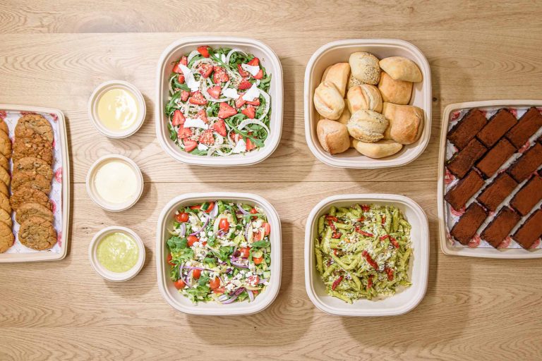 A delicious and satisfying spread of fresh salads and desserts, perfect for any occasion.