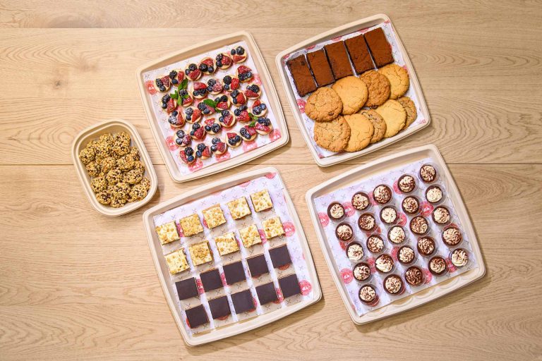 An irresistible display of mouthwatering desserts, including cakes, pastries, and cookies, sure to satisfy any sweet tooth.