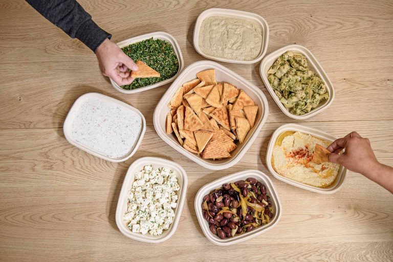 A tempting assortment of mezze, featuring an array of small plates and dips, including hummus, baba ghanoush, and olives.