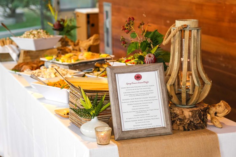 A beautifully presented buffet table with a wide variety of delicious food options.