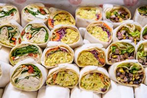 A mouthwatering display of freshly made wraps, featuring an array of flavors and ingredients that are both delicious and satisfying.